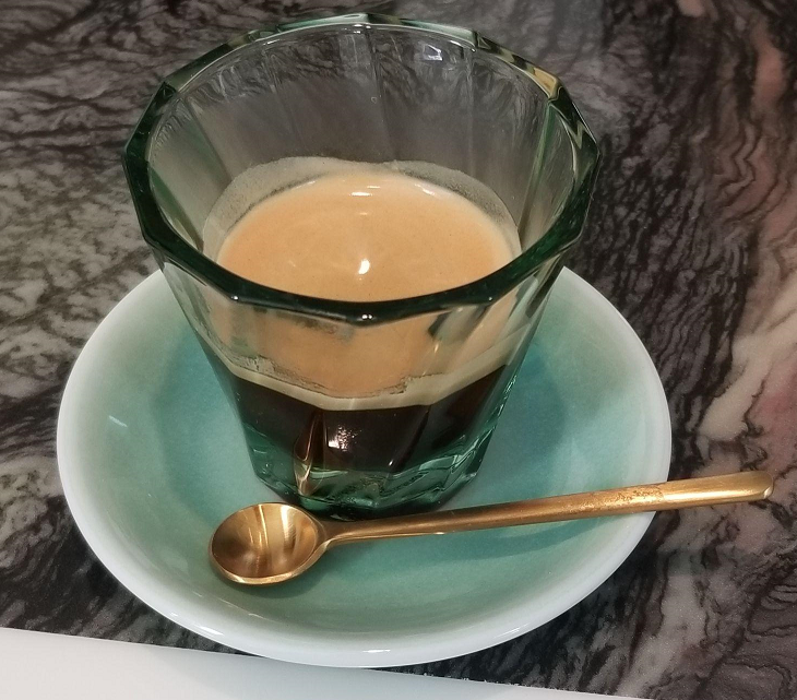 Espresso Shot pulled from a Nomad in a Premium Cup